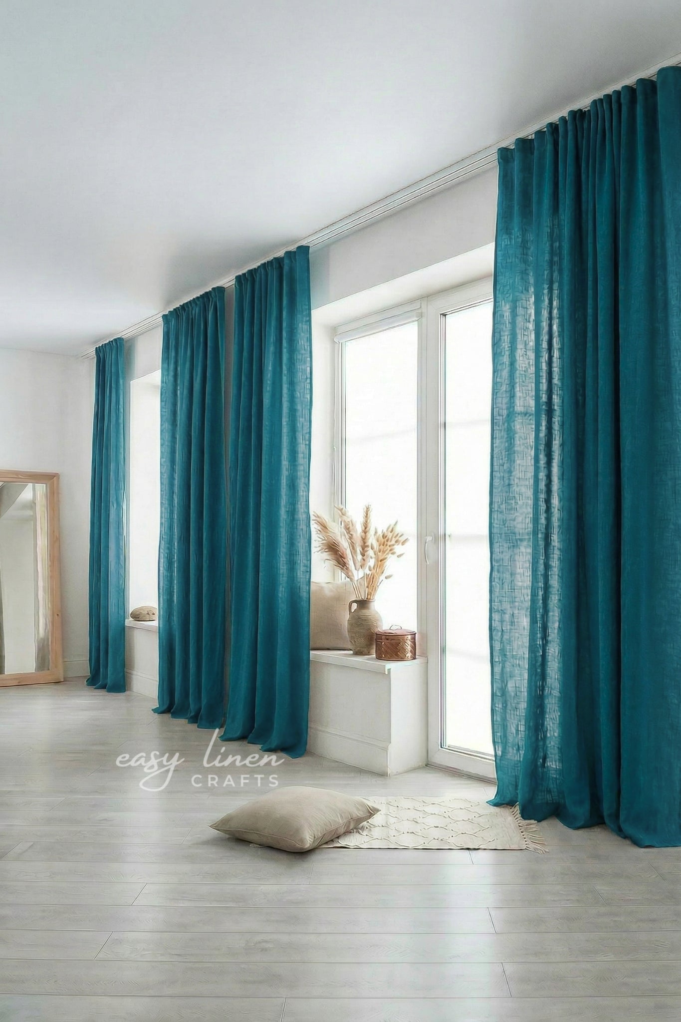 Teal curtains in a room with a mirror and decor items.