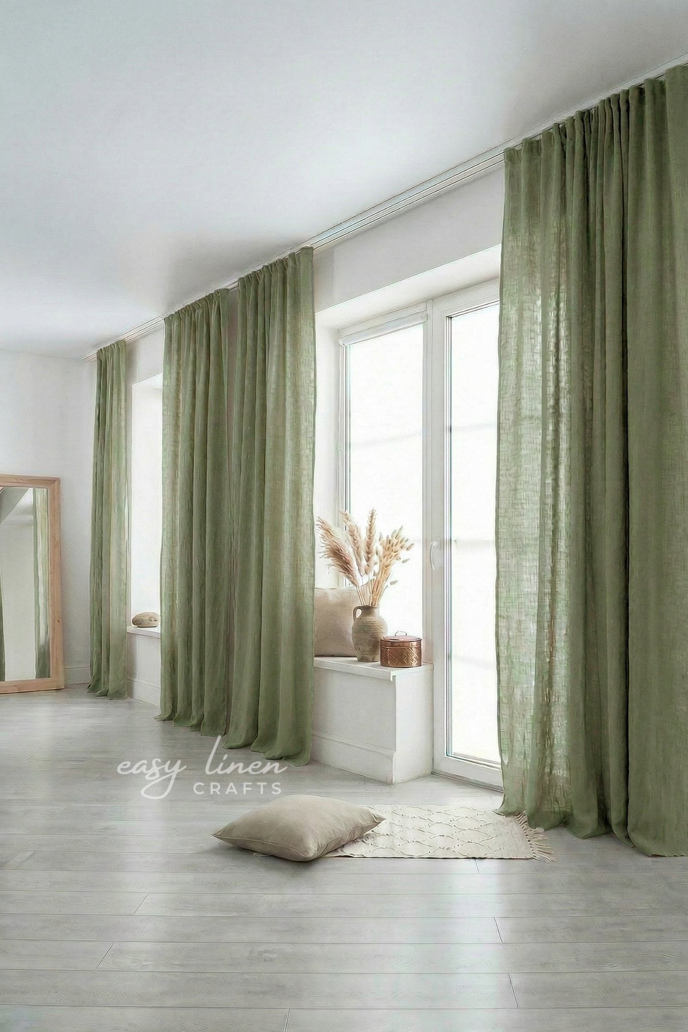 Green curtains in a room with a window and decor elements.