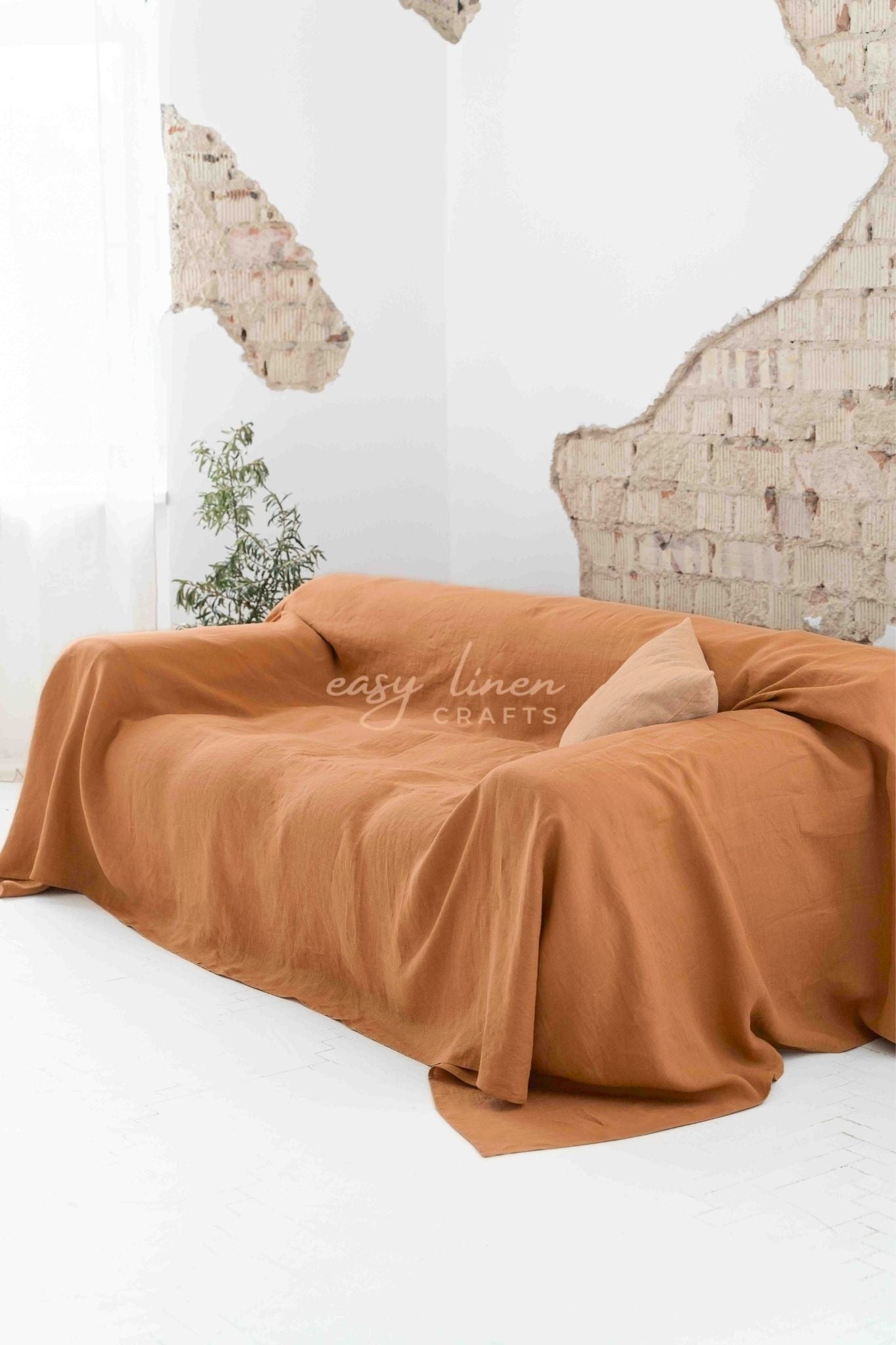 Linen couch cover in Amber Orange color. Custom sizes available