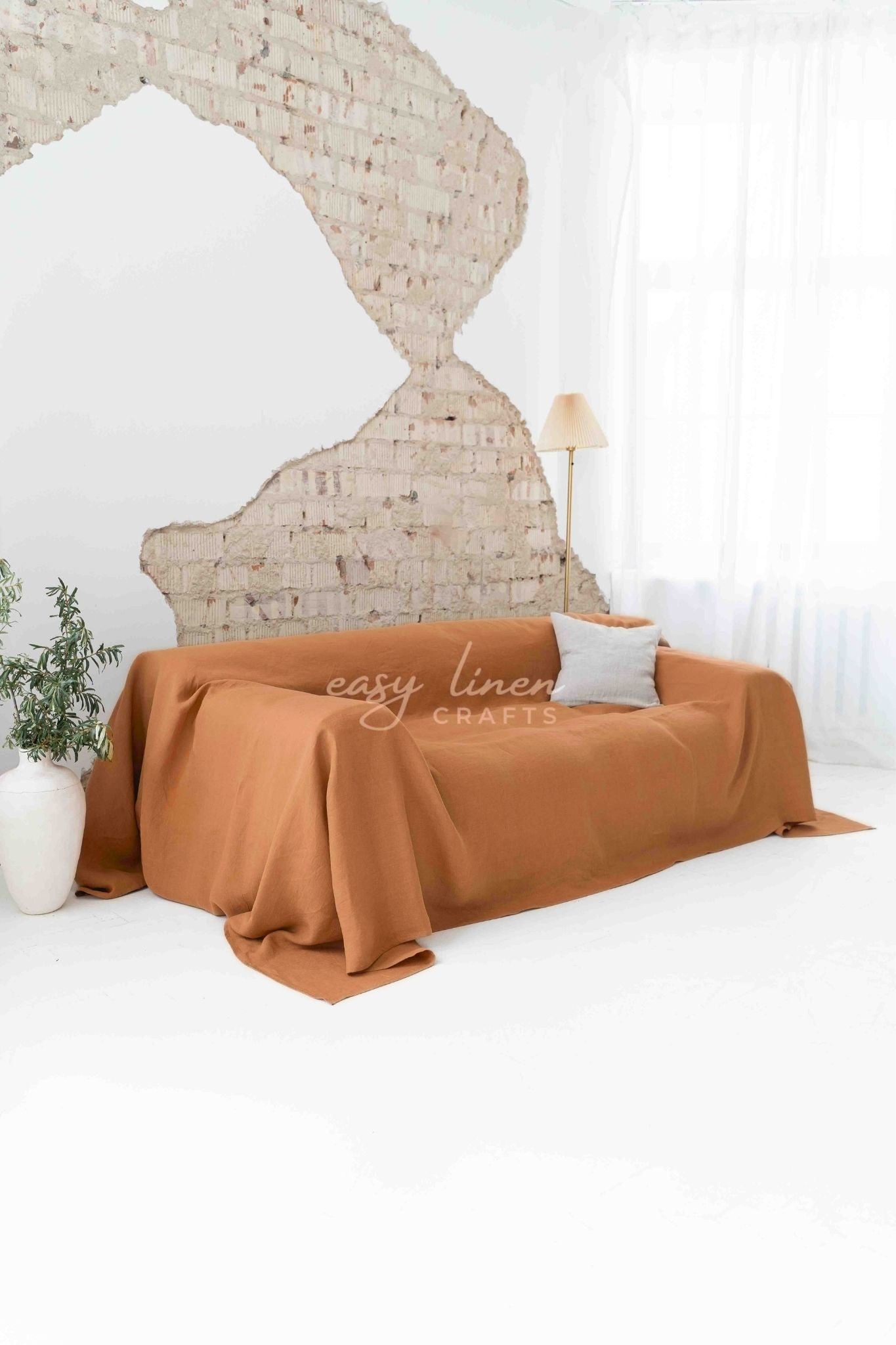 Linen couch cover in Amber Orange color. Custom sizes available
