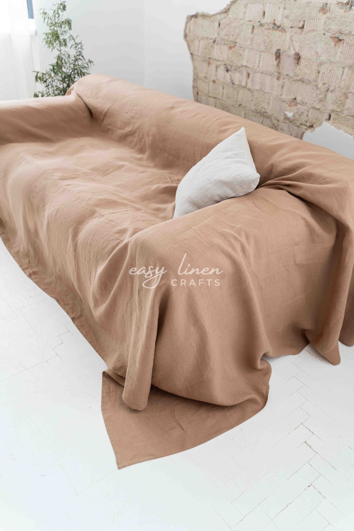 Linen couch cover in Camel Brown color. Custom sizes available