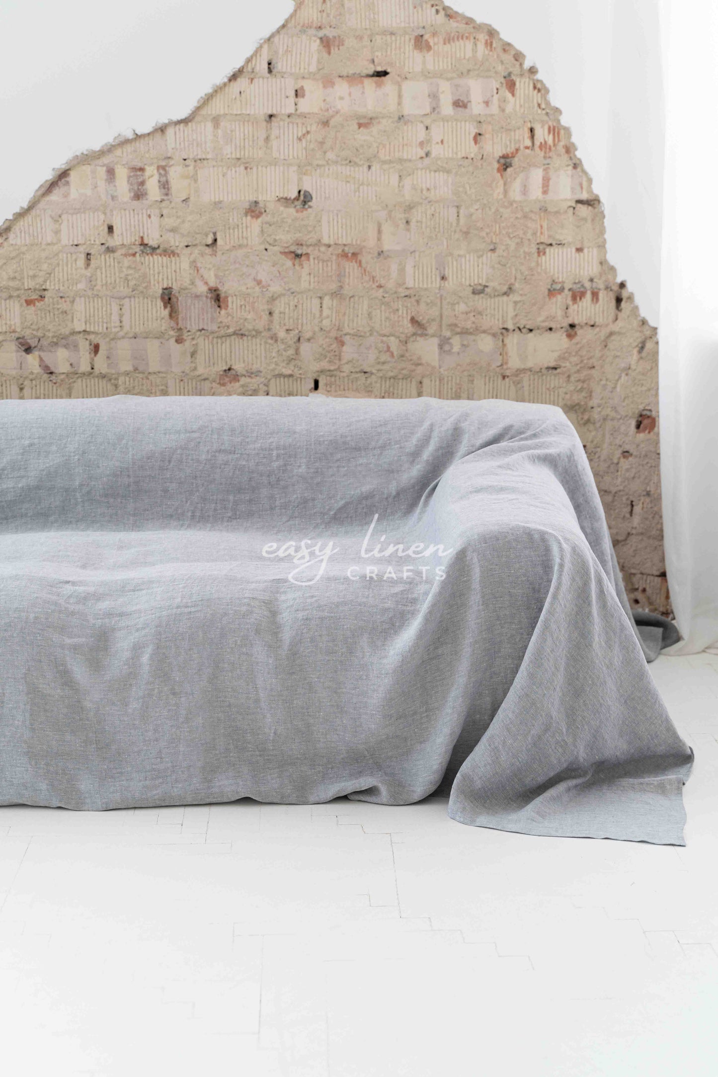 Linen couch cover in Melange Gray color. Custom sizes available