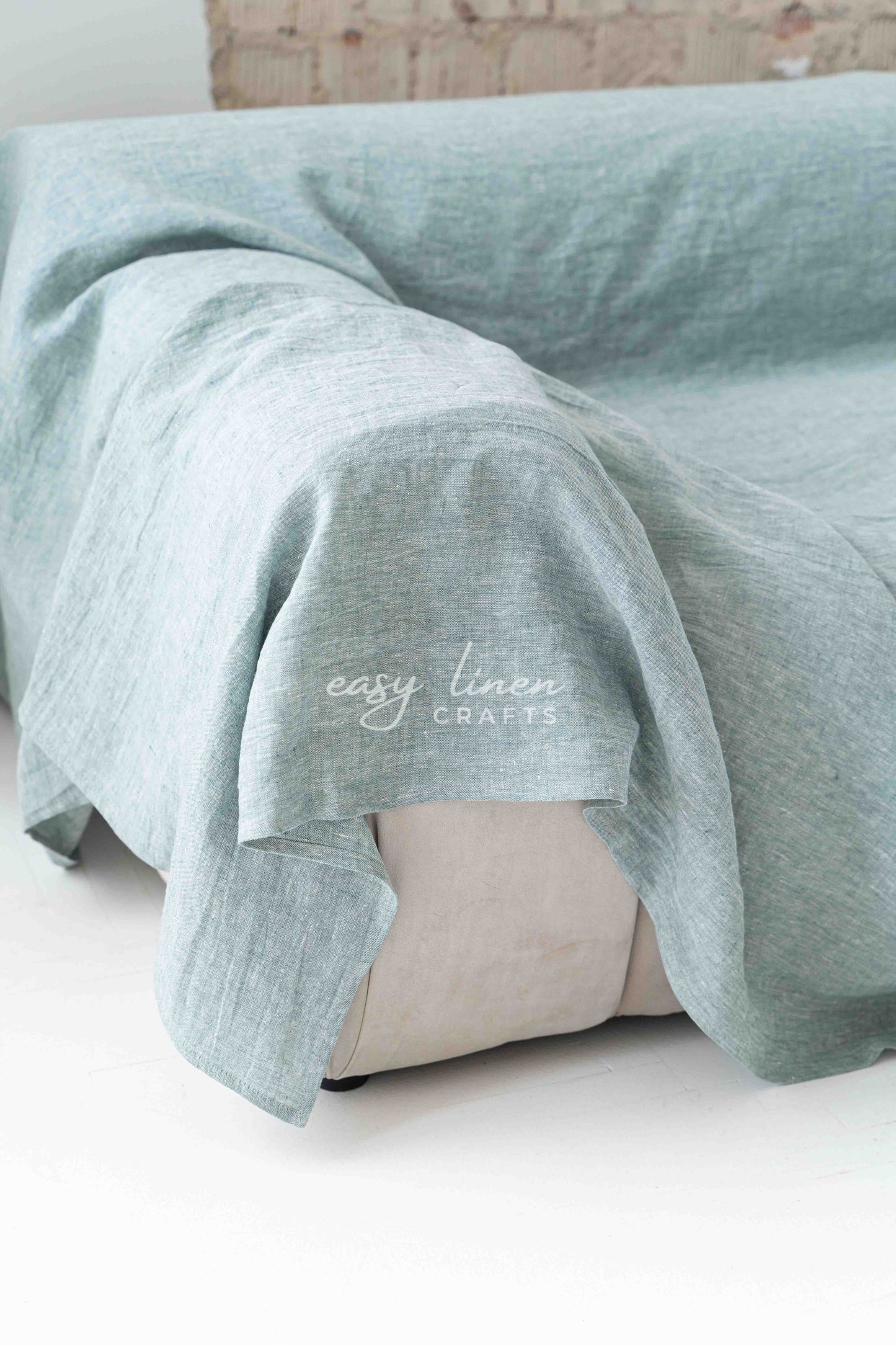 Linen couch cover in Melange Green color. Custom sizes available
