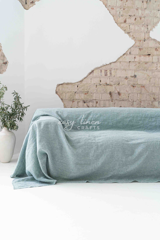 Linen couch cover in Melange Green color. Custom sizes available