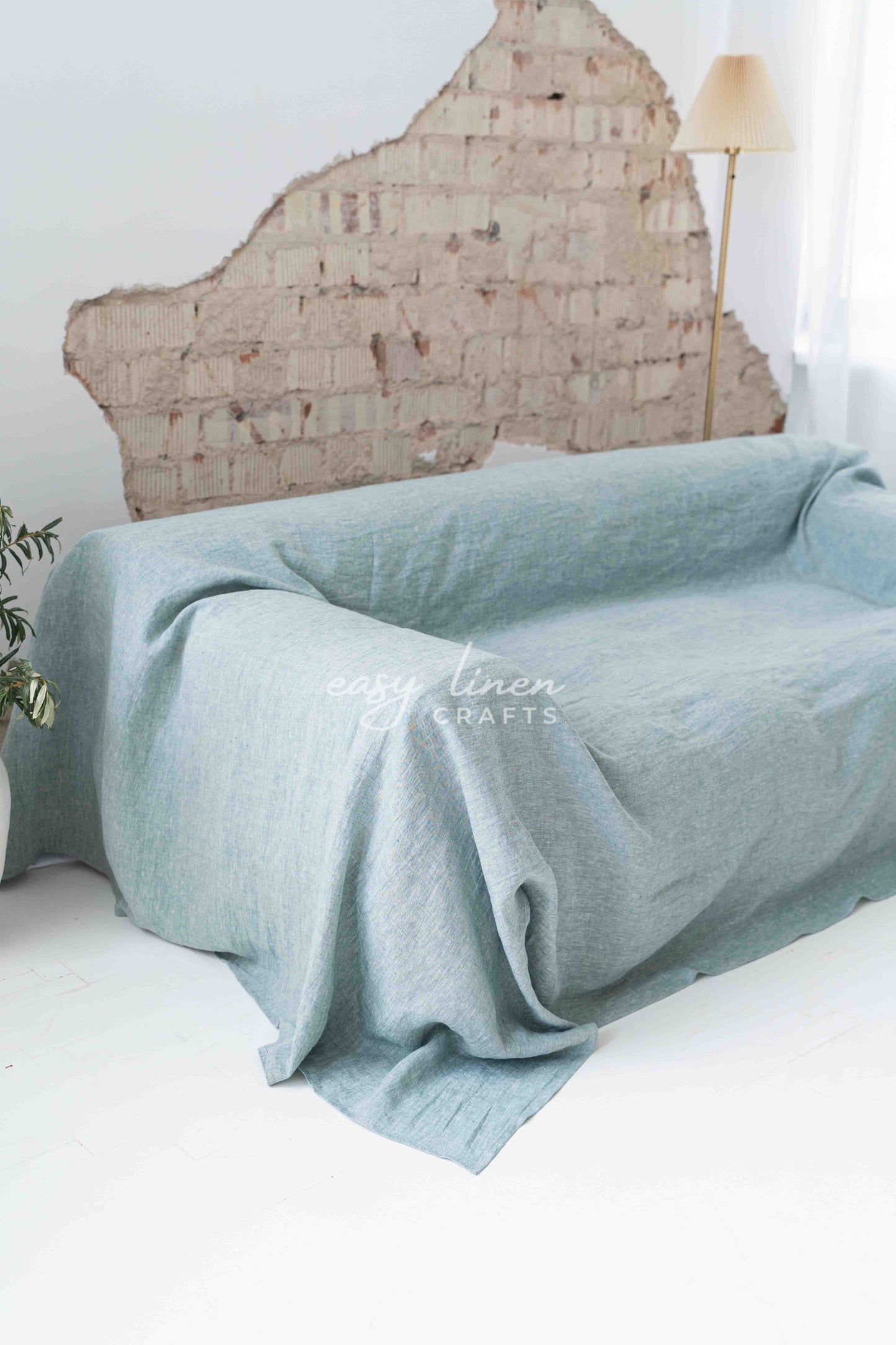 Linen couch cover in Melange Green color. Custom sizes available