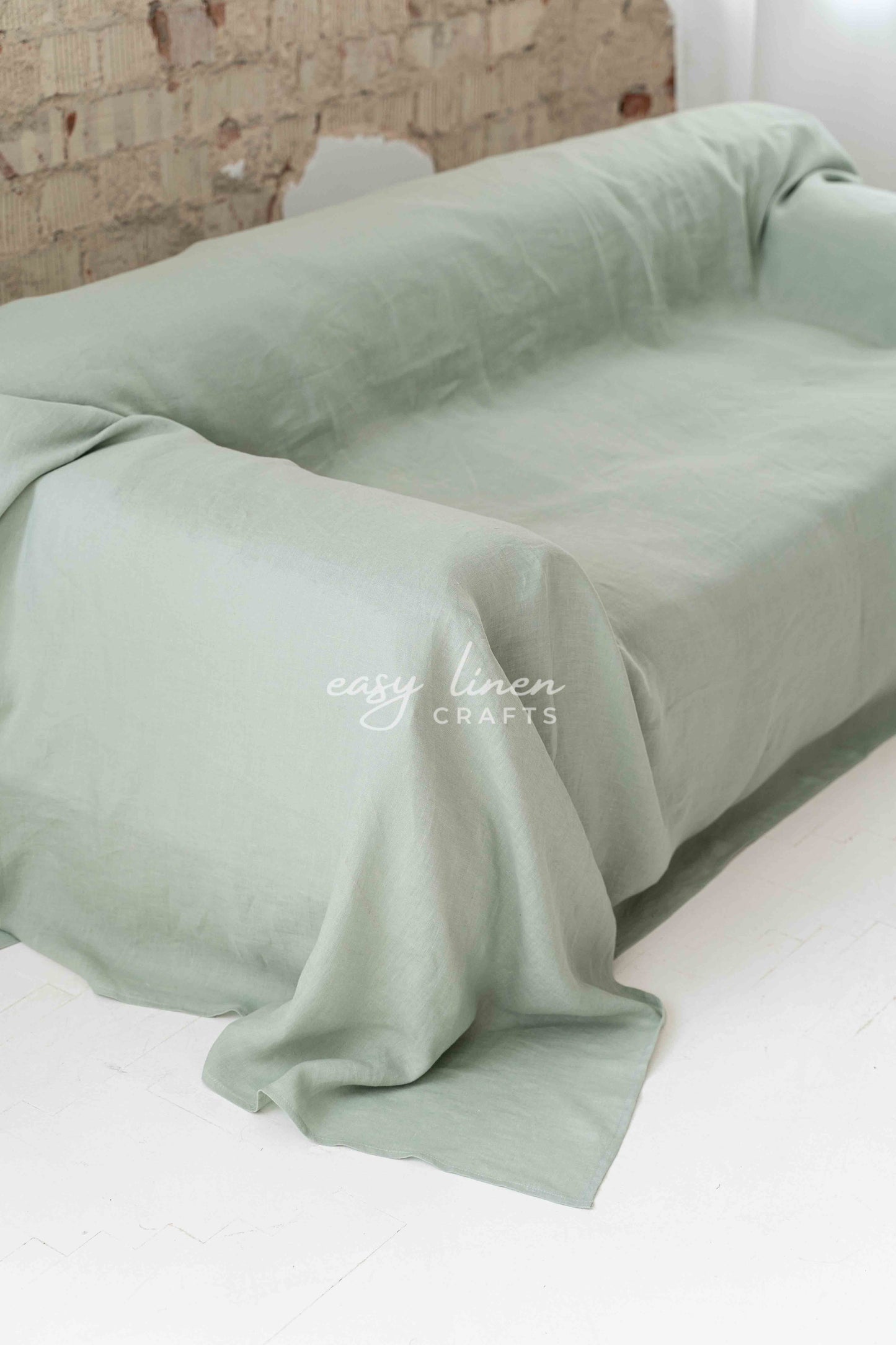 Linen couch cover in Sage Green color. Custom sizes available