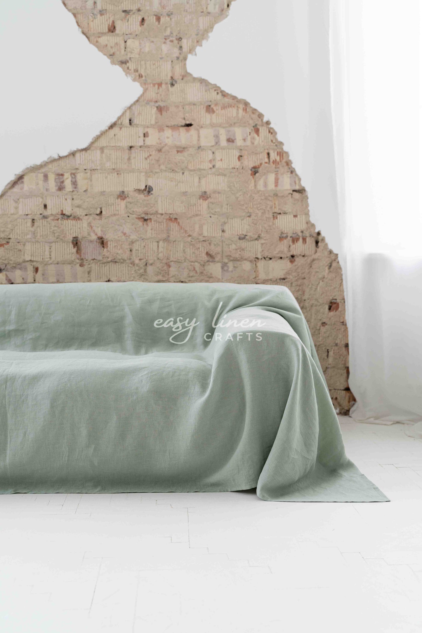 Linen couch cover in Sage Green color. Custom sizes available