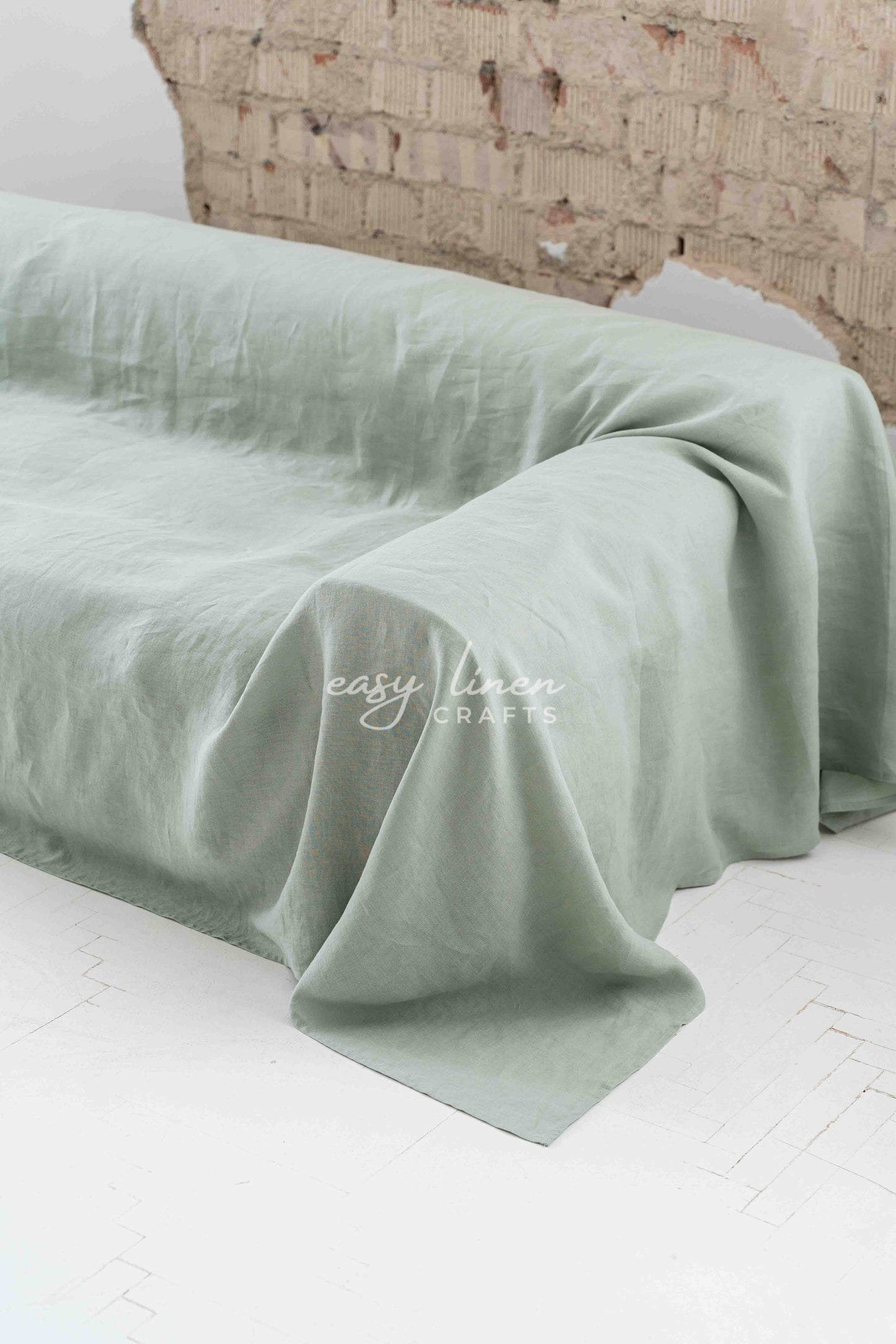 Linen couch cover in Sage Green color. Custom sizes available