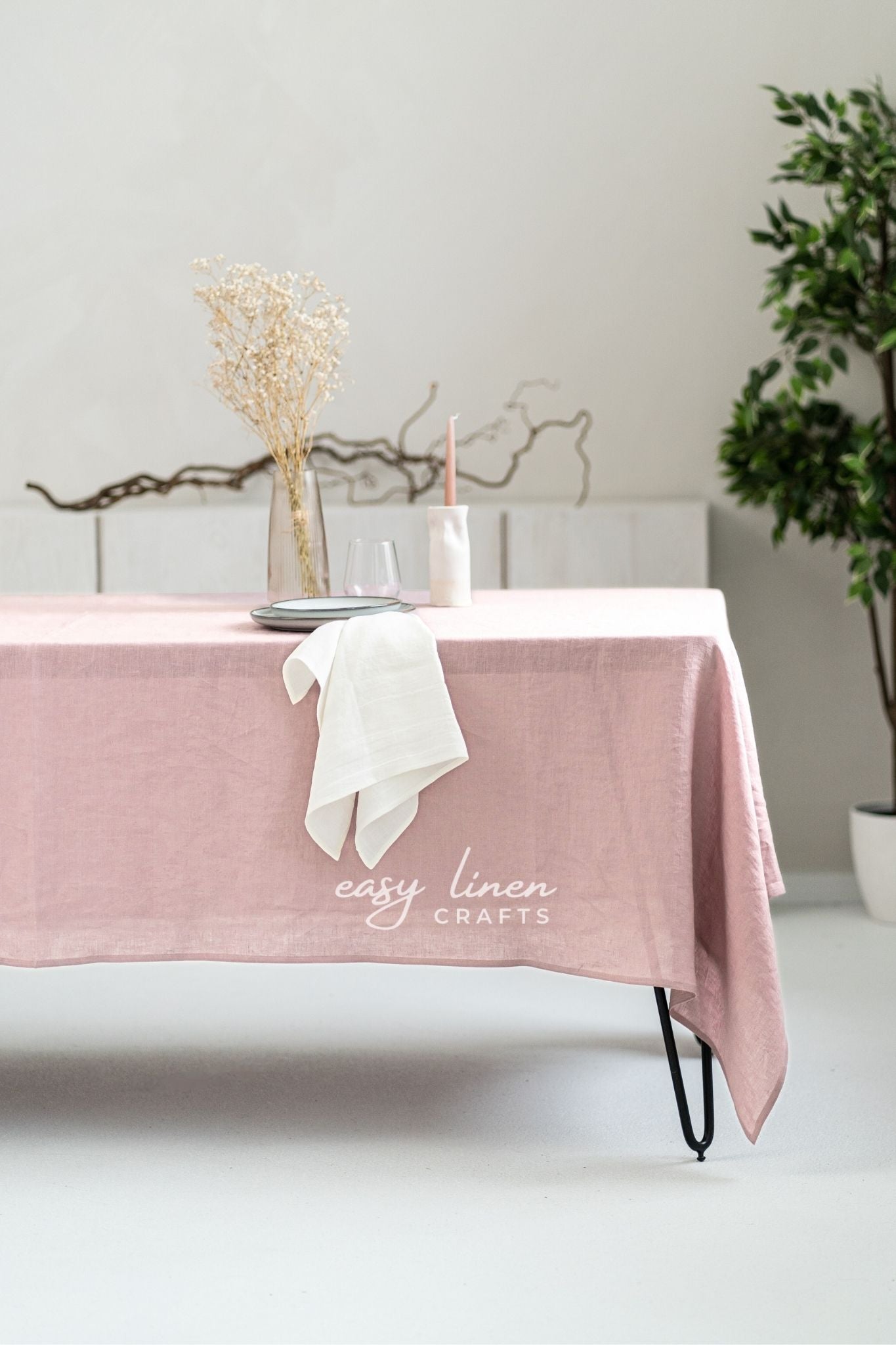 Pink linen tablecloth on a dining table