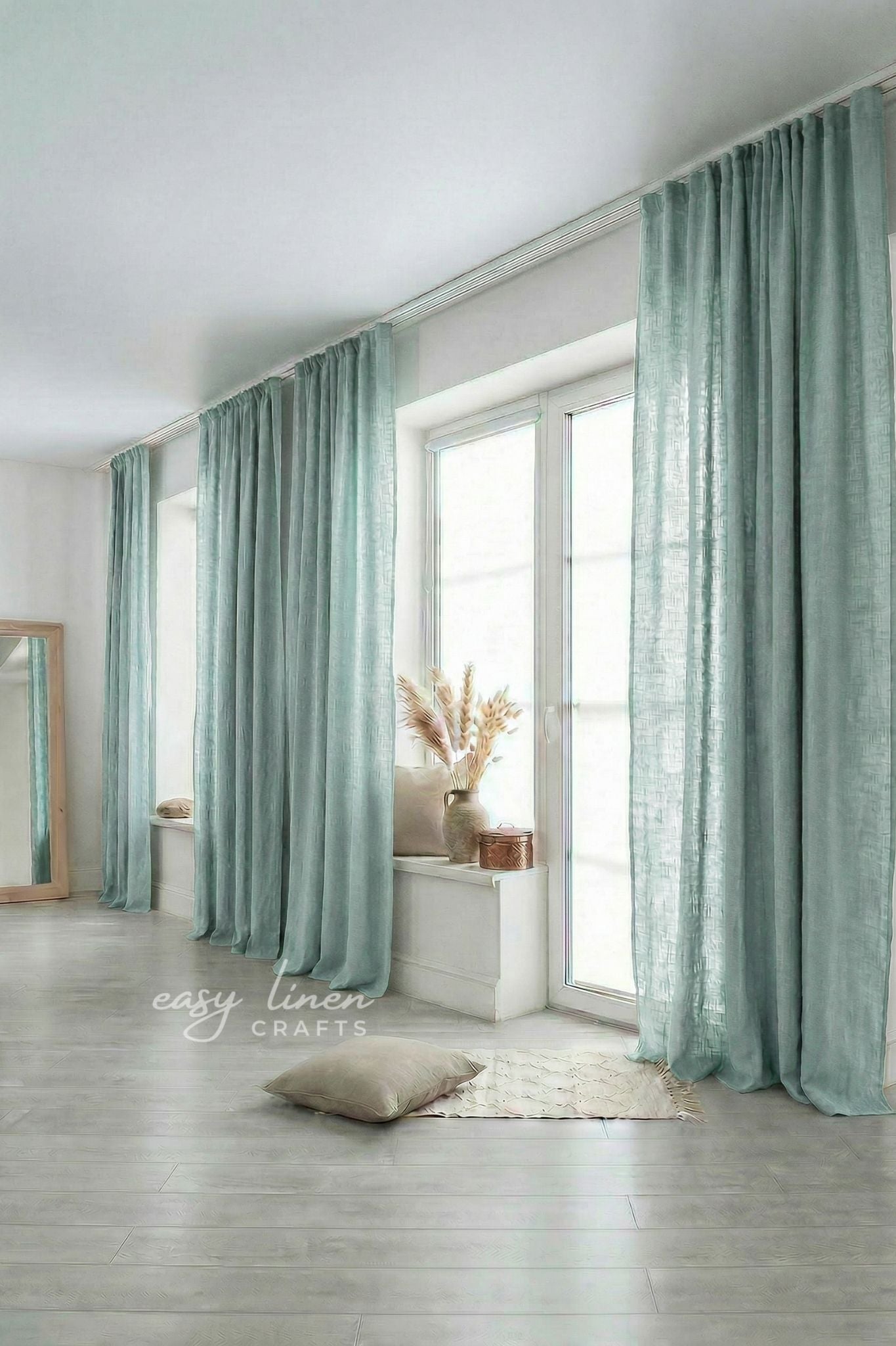 Light green curtains in a room with a white floor and light-colored walls.