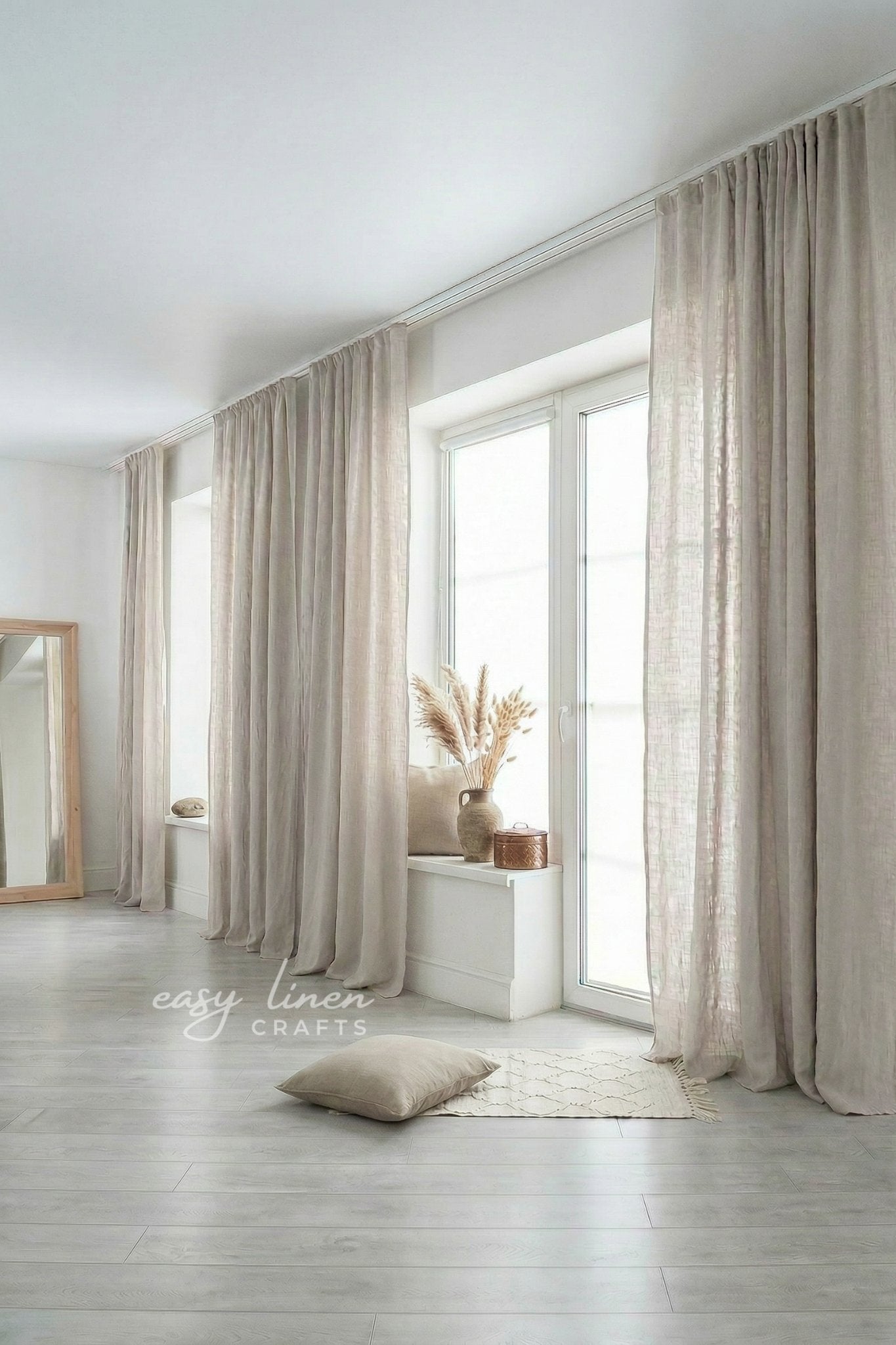 Beige curtains in a room with a mirror and decor items.