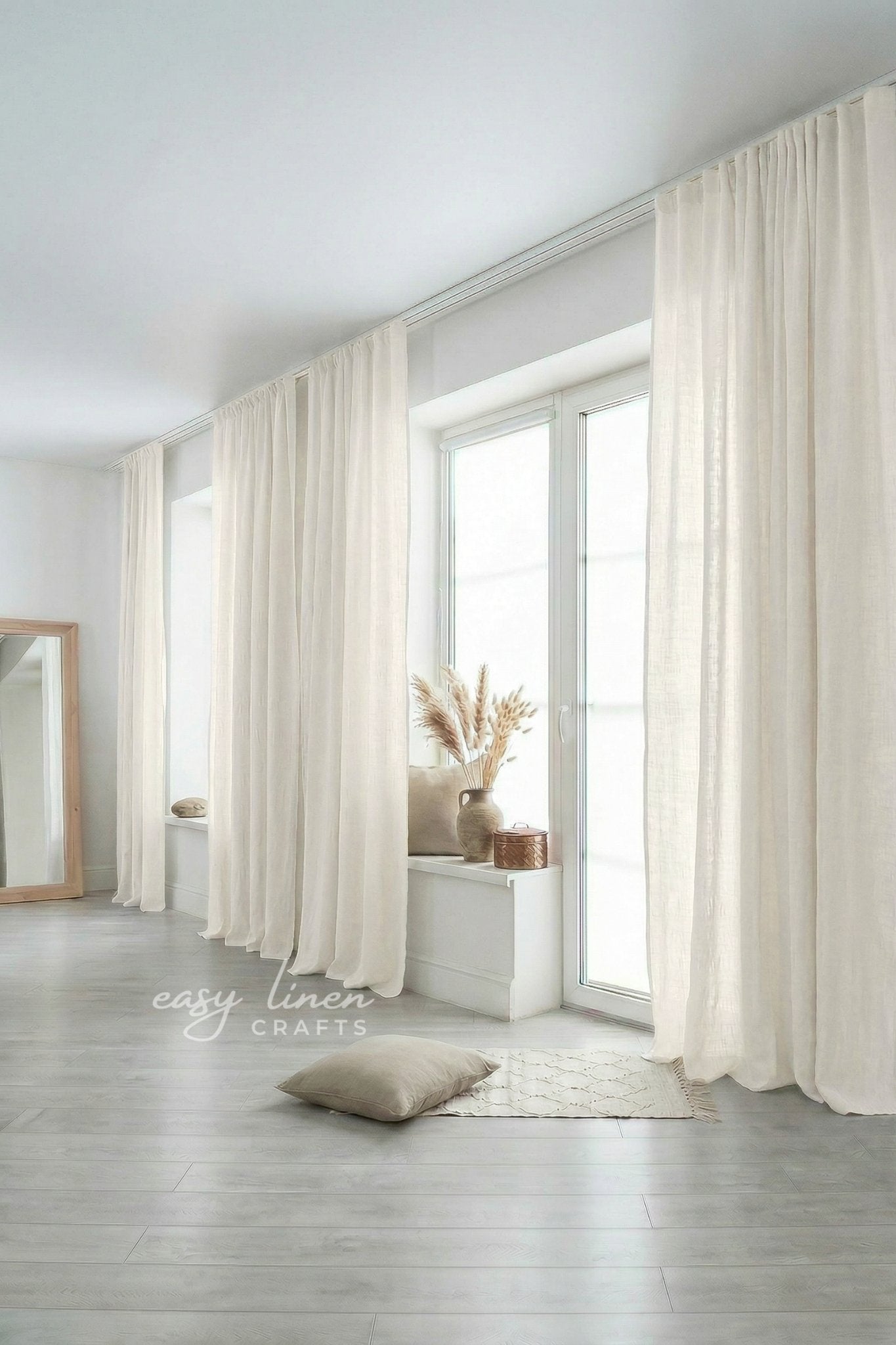 Ivory curtains in a room with a mirror and decor items.