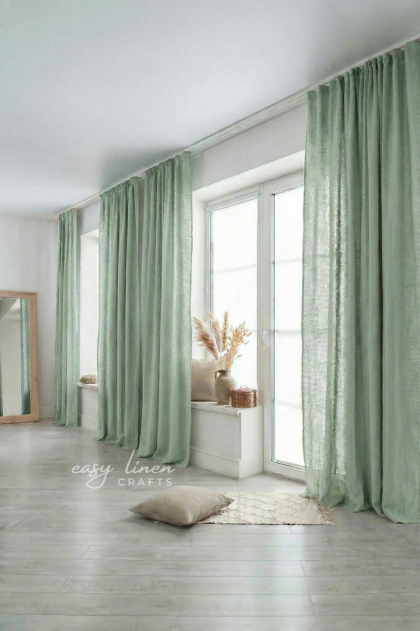 Green curtains in a room with a mirror and decor items.