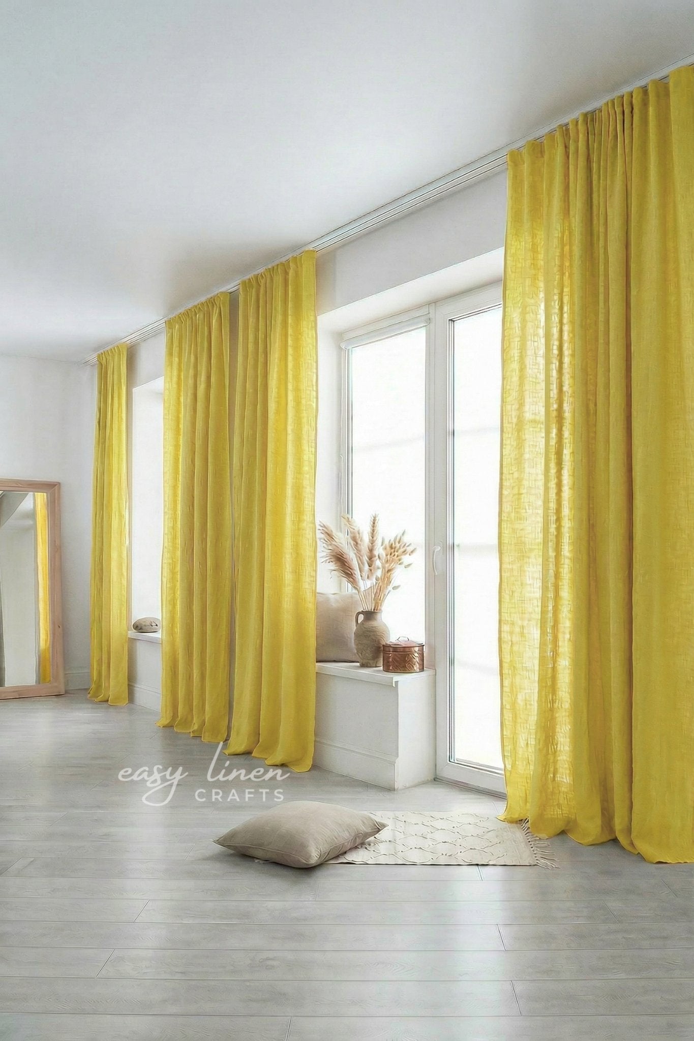 Yellow curtains in a room with a mirror and decor items.