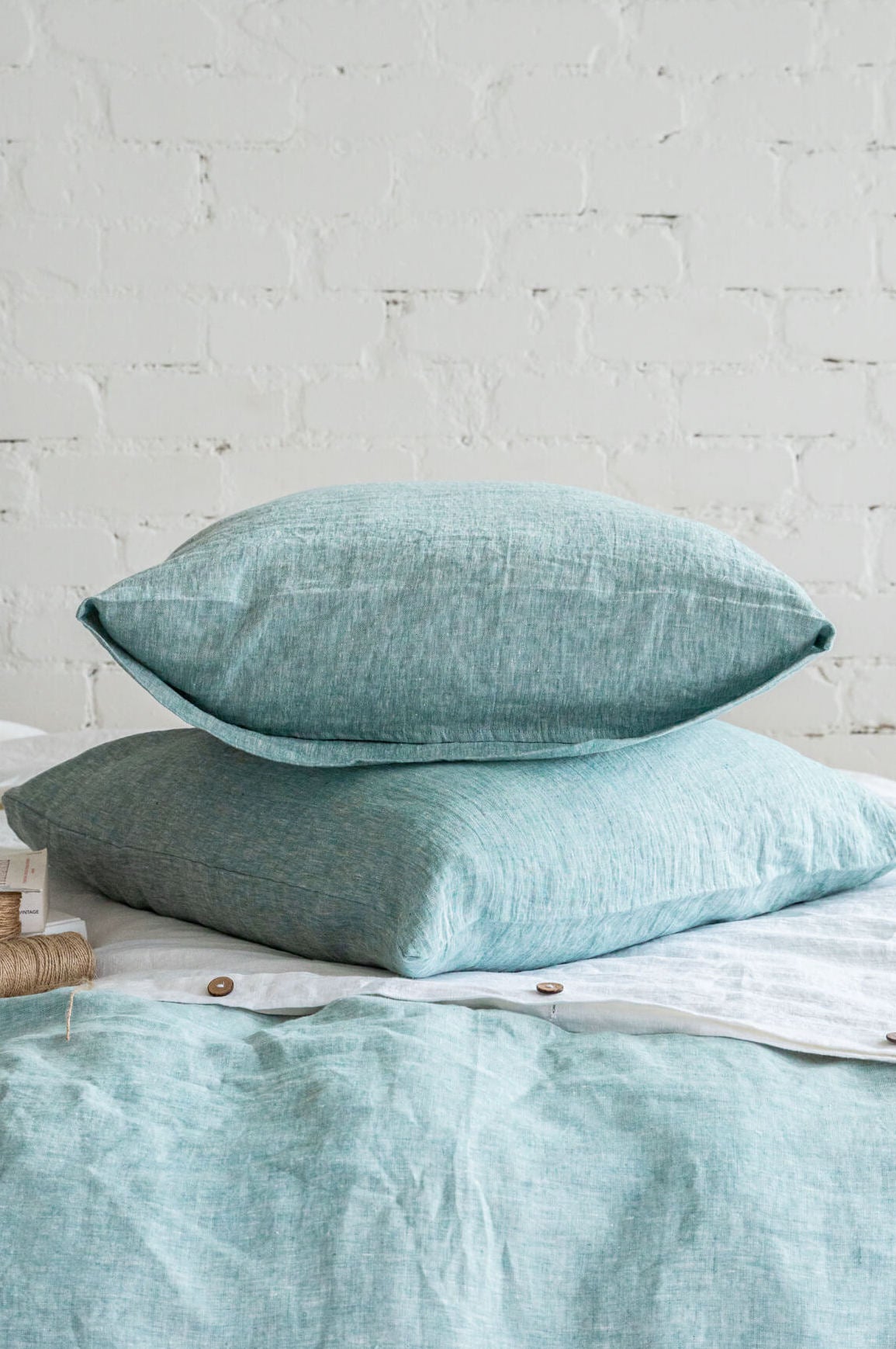 Linen pillow cover with envelope closure in Melange Green color