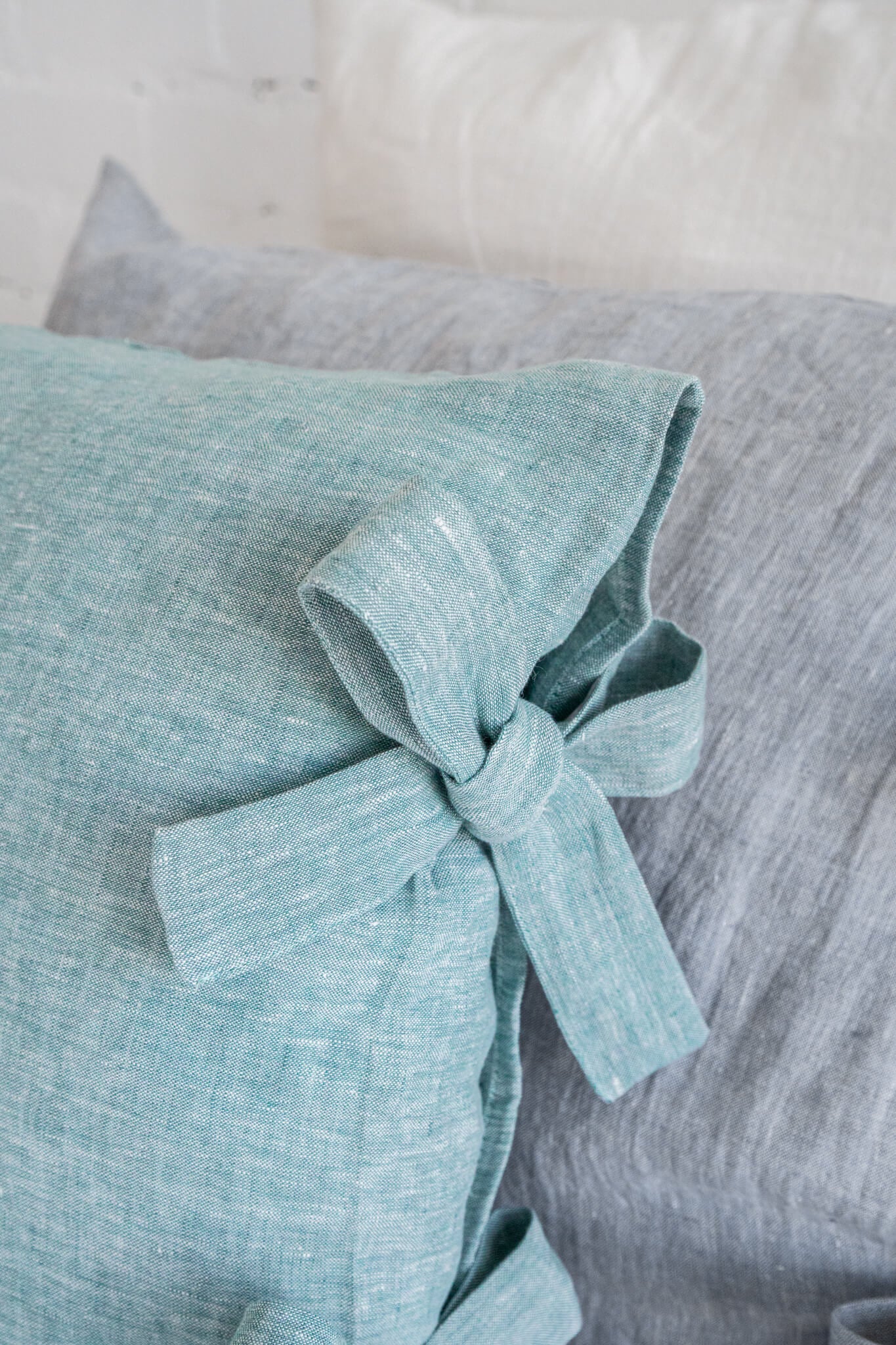 Linen pillow cover with ribbon ties in various colors